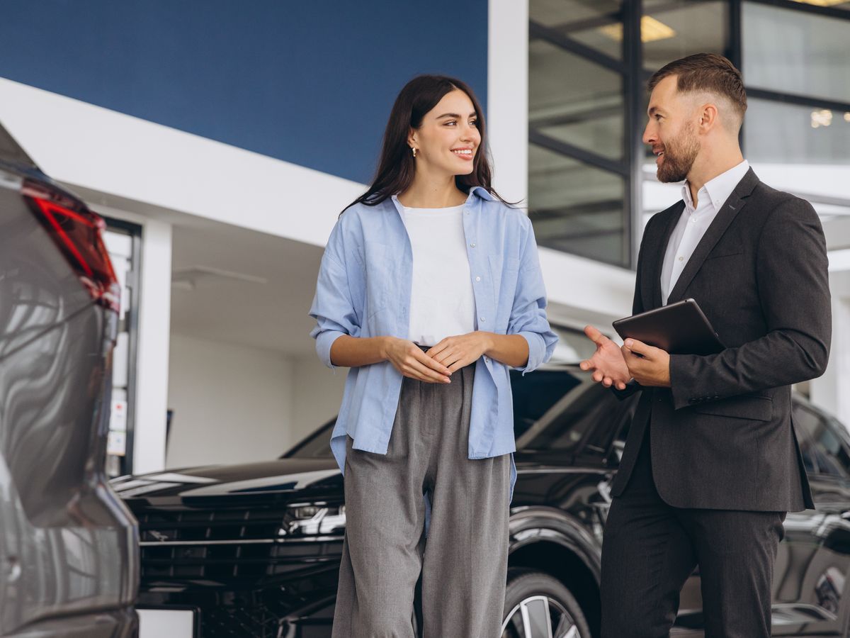 A salesperson talking with a customer in a showroom